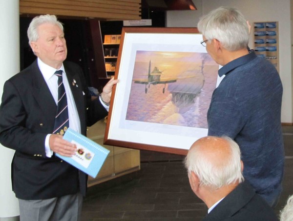 GLARAC Hon. President David Woodcock presents framed print of Sqn Leader Cross landing his Hurricane on Glorious, to The Trondenes Historical Centre. 